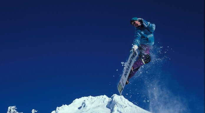 Kim Kardashian Shows Off Deep Cleavage In Plunging Top & Mini